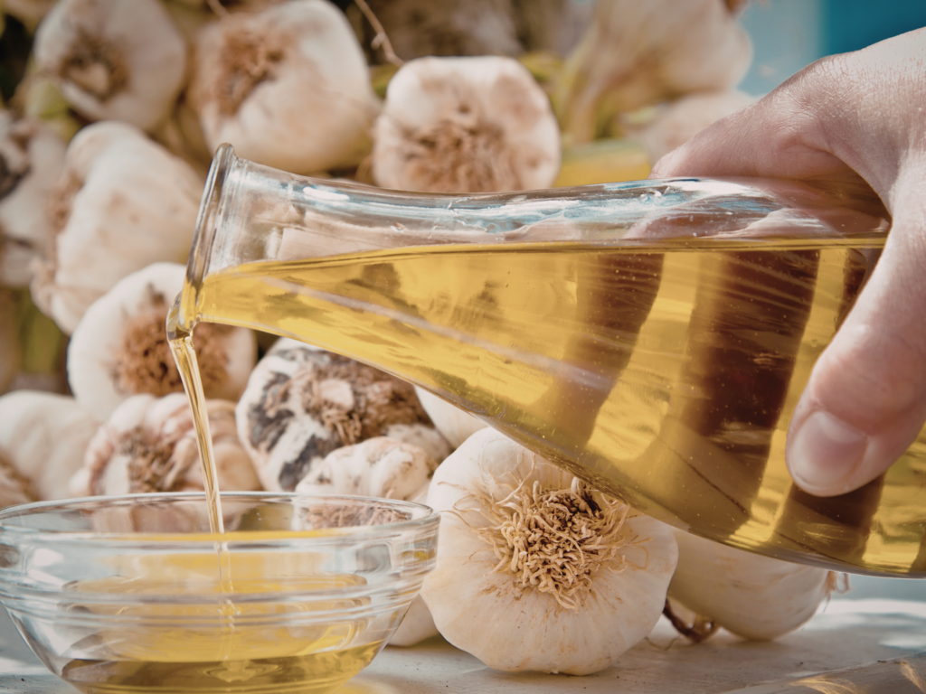 pouring garlic oil